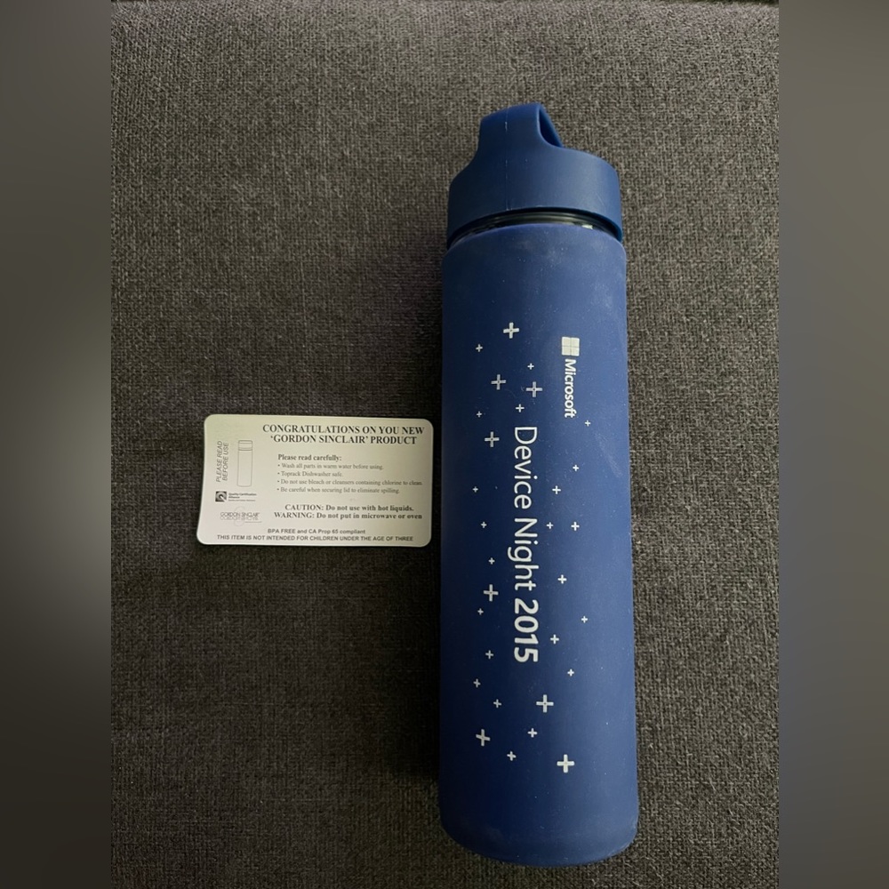 Brand New Reusable Gordon Sinclair Glass Water Bottle With Blue Silicone Sleeve